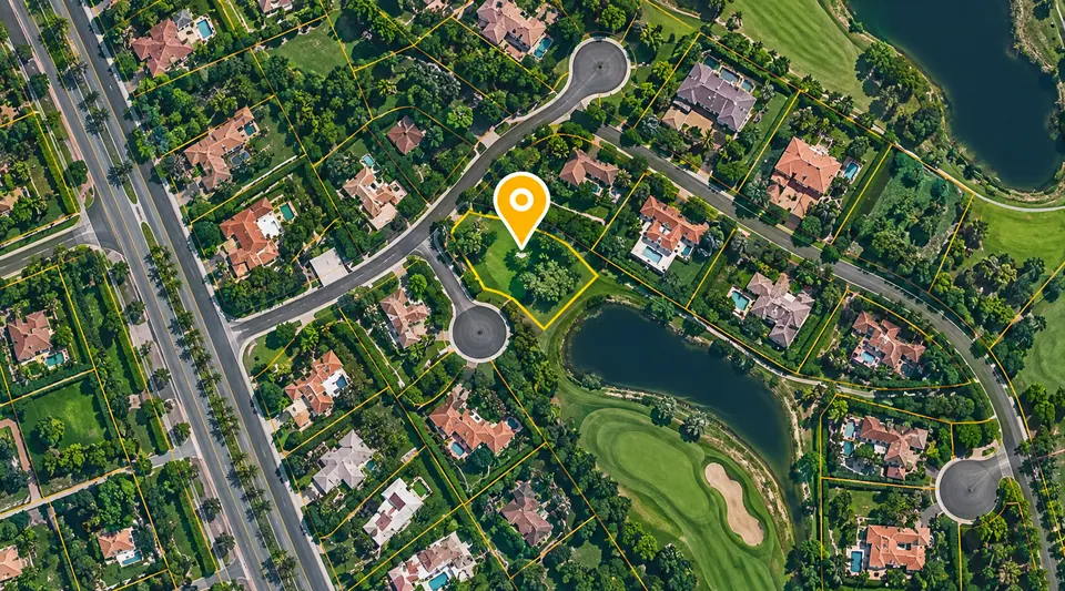 Residential parcels viewed from above with a location marker